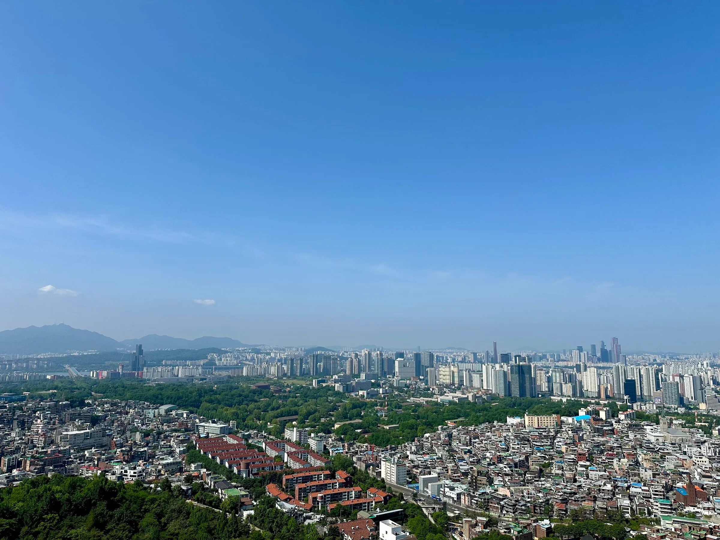 The southwest skyline of Seoul from the Namsan Photo Island viewpoint with the Yeouido cluster on the right.