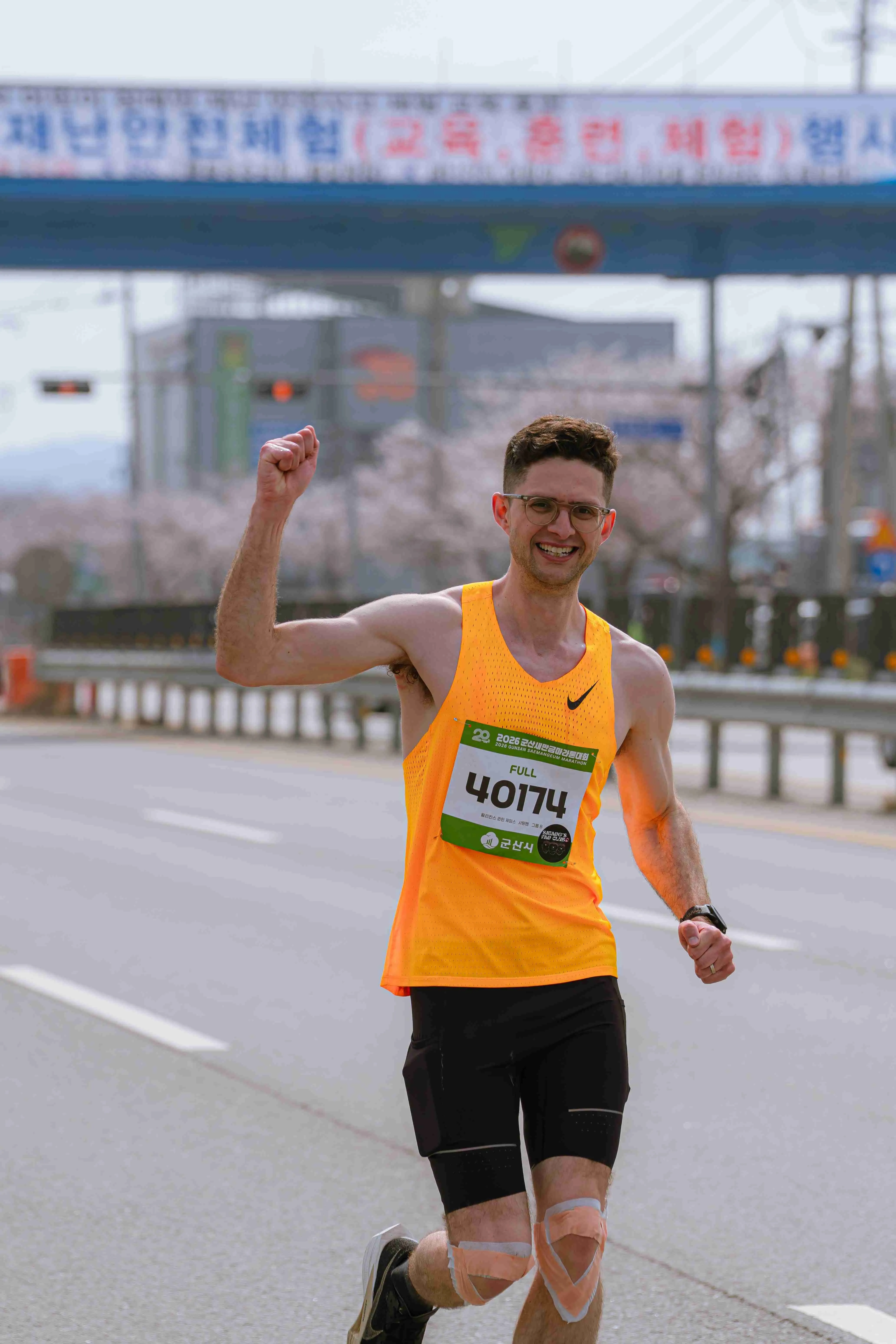 Quintin celebrating at the finish of the 2026 Gunsan Saemangeum Marathon.