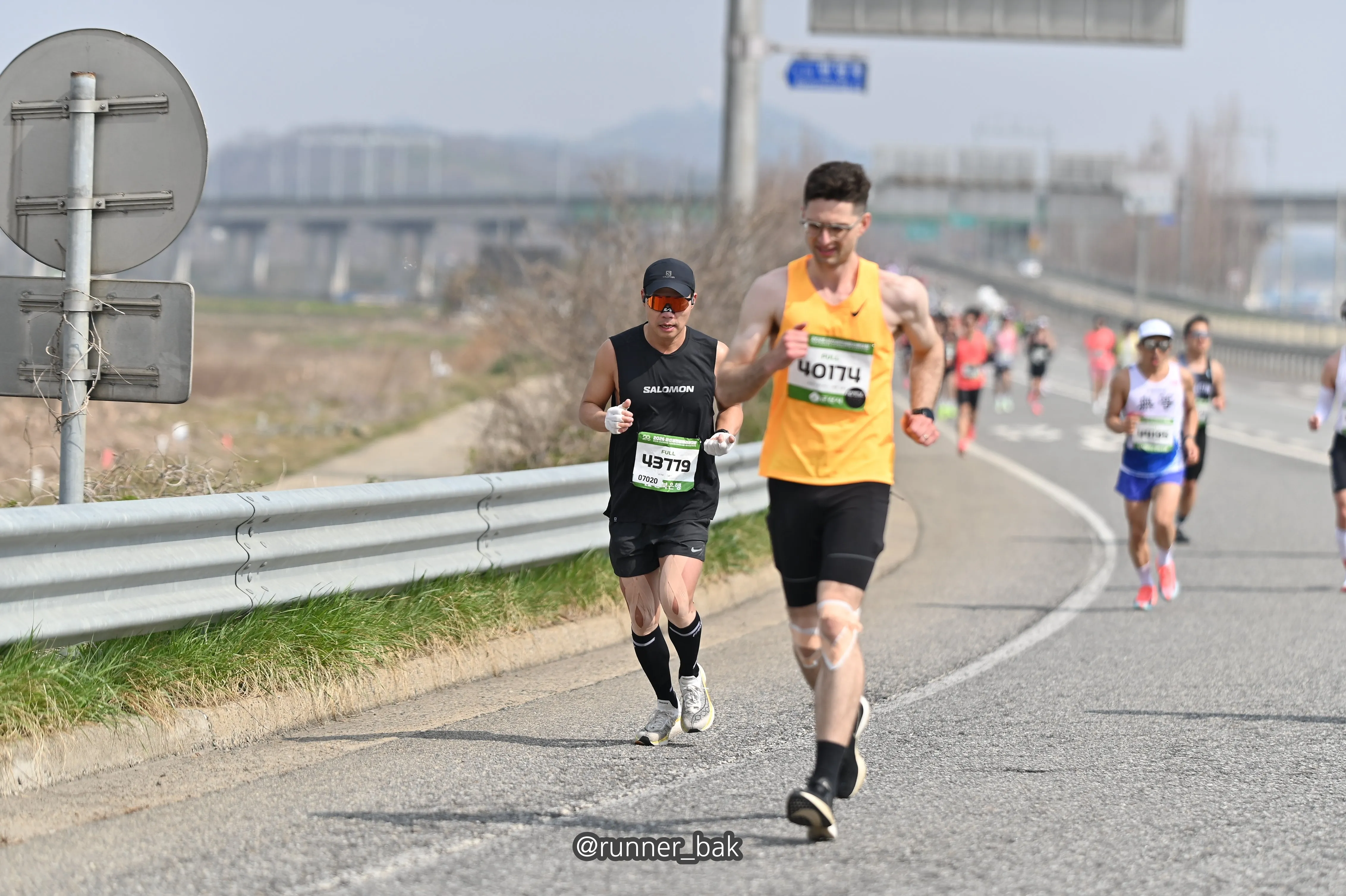 Open road on the 2026 Gunsan marathon course, the divided highway in the final stretch.