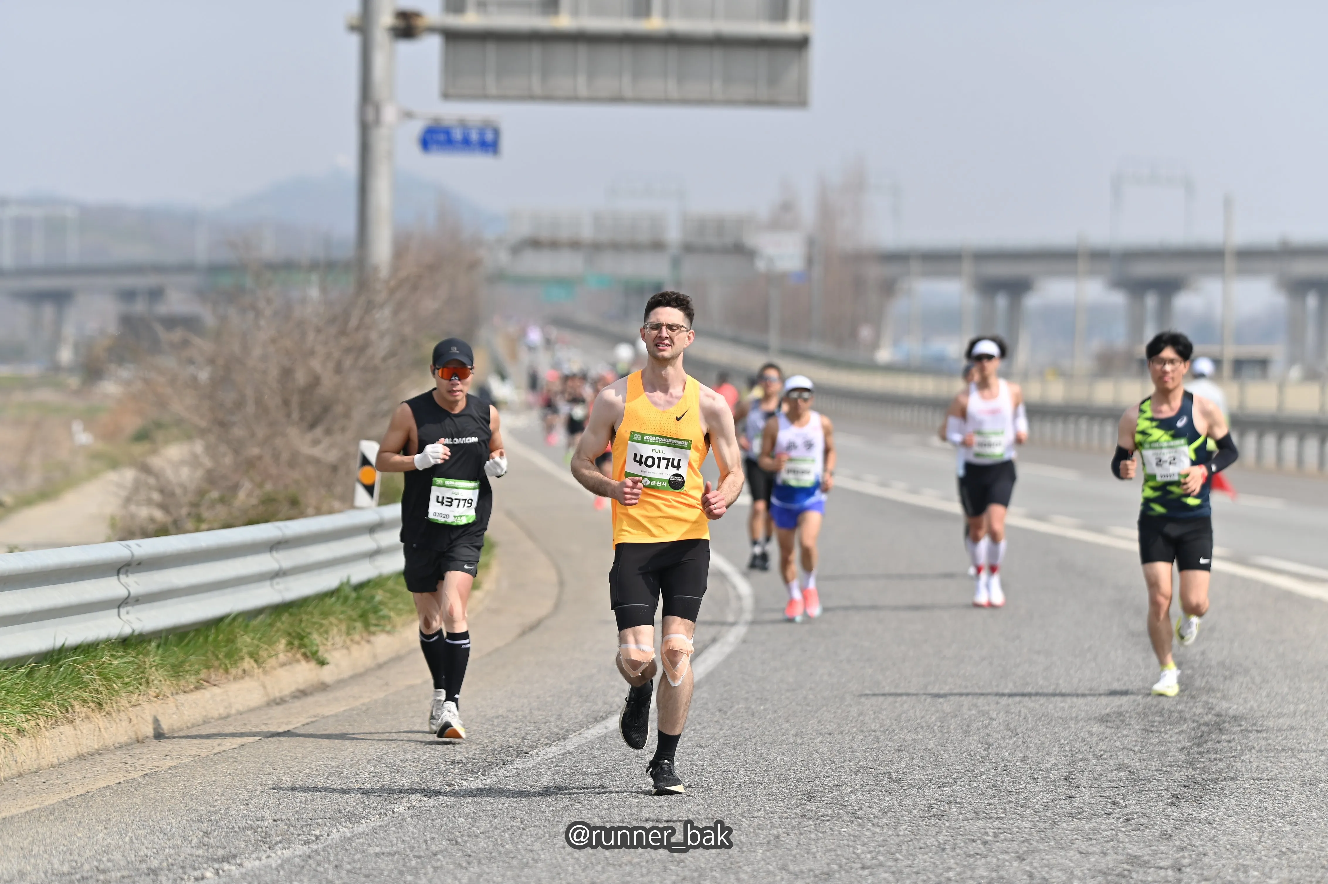 Quintin running with a pack of runners at the 2026 Gunsan marathon.