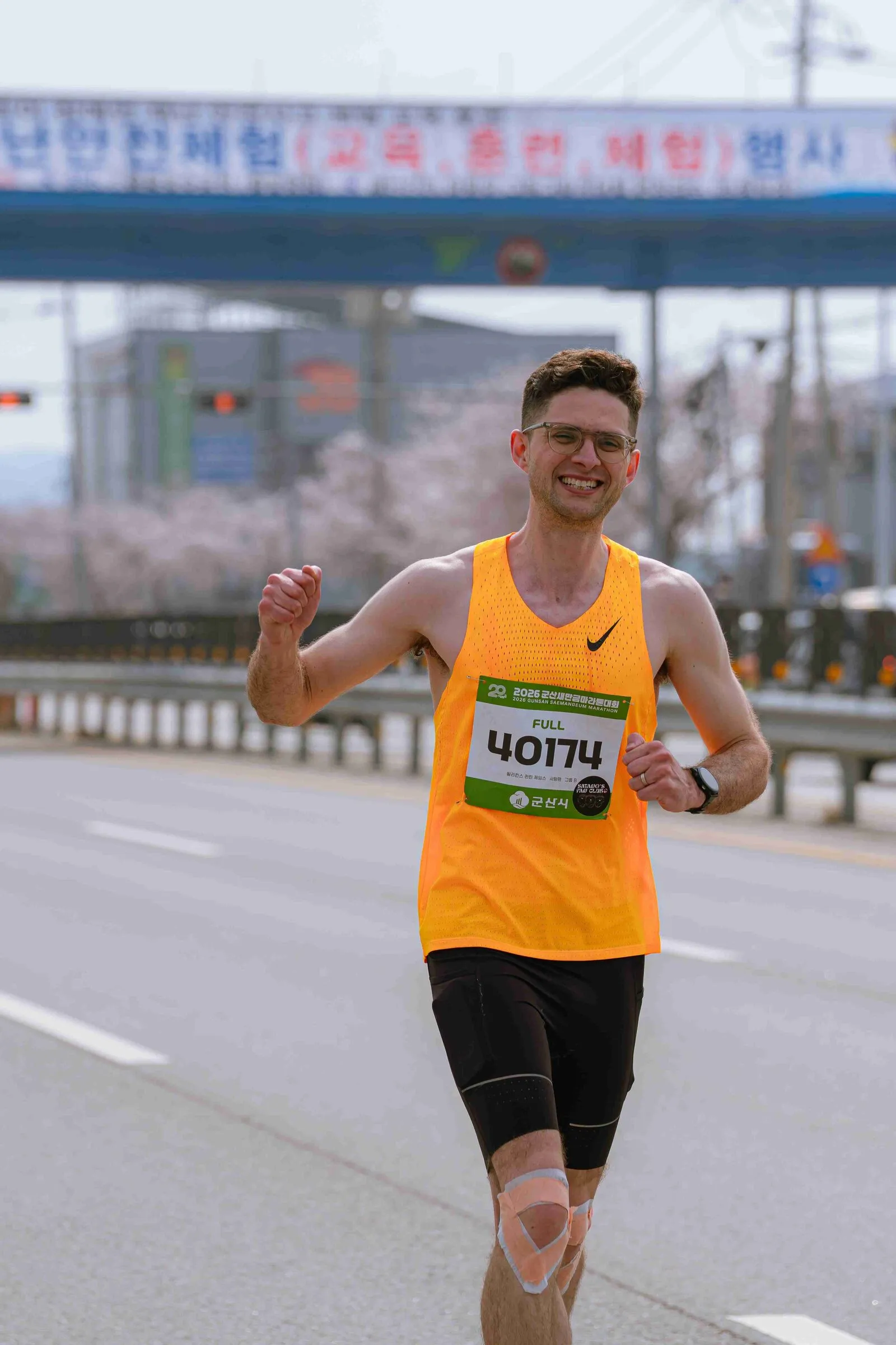 Quintin smiling as he runs a road race in Korea.